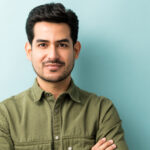 man standing against blue background